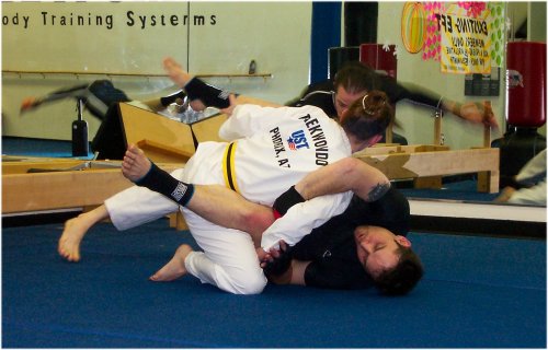 Melanie & Chris during workout with Mike as referee